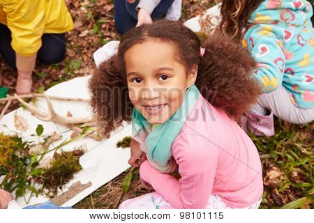 Girl Looking For Minibeasts At Activity Centre