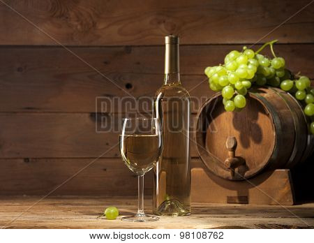 White wine on wooden background