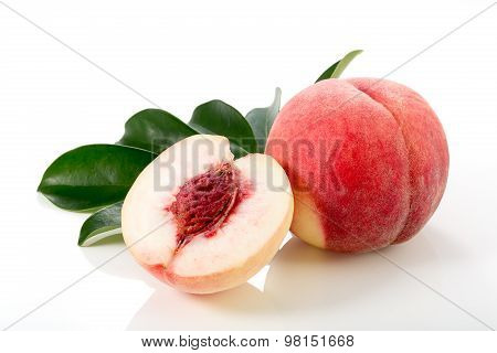 Ripe Peach Fruits With Green Leaves Isolated On White Background