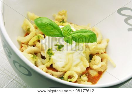 Appetizer Bowl Of Gazpacho With Fried Calamari Squid And Basil Mousse