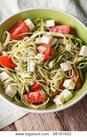 Healthy Zucchini Pasta With Cheese And Tomato Close Up Vertical