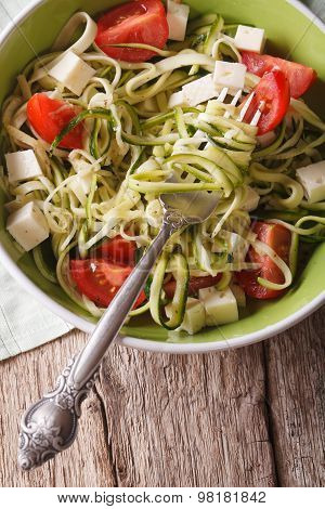 Zucchini Pasta With Cheese And Tomato Close Up In A Bowl. Vertical