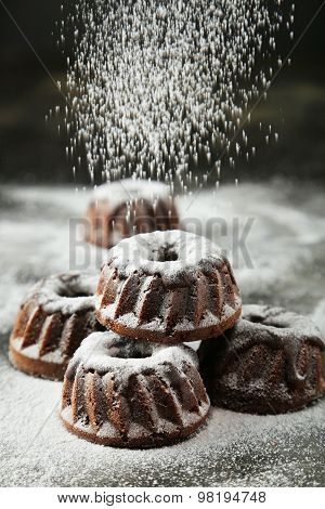 Chocolate Bundt Cakes With Icing Sugar On Black Background
