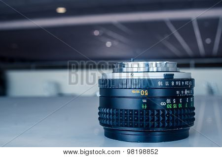 50mm lens inverted on table at lounge