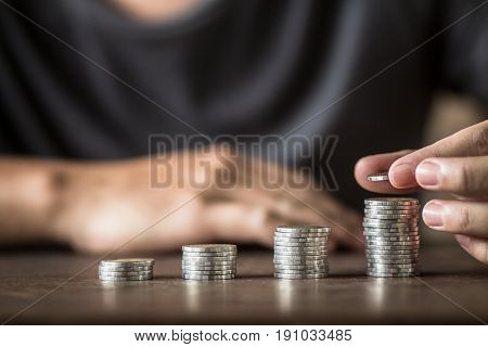 Collecting silver coins Adding money Men's hands are raising money