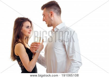 man with girl drink champagne in the Studio isolated on white background