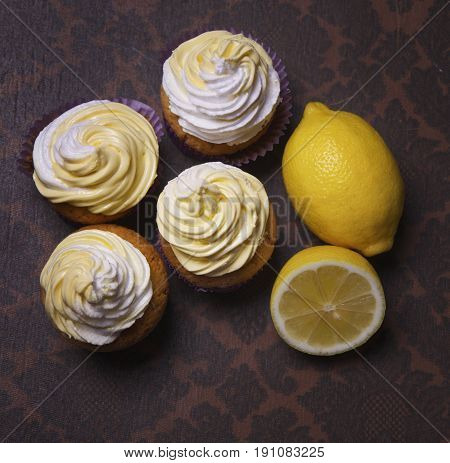 delicious freshly baked homemade lemon muffins cupcakes with butter cream onl copy space