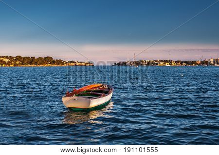 Lonely boat sailing free in the blue sea