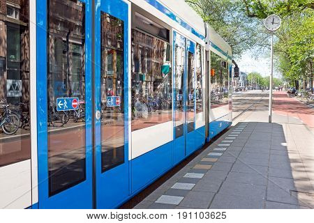 Tram departing from Weesperplein in Amsterdam Netherlands