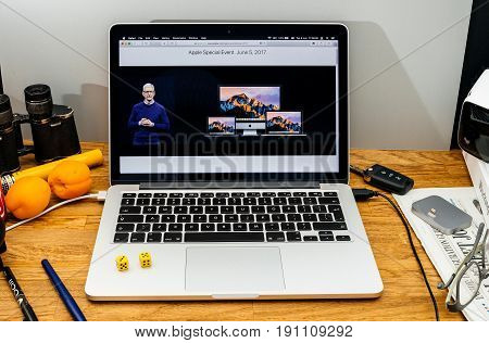 PARIS FRANCE - JUNE 6 2017: Apple Computers website on MacBook laptop in creative environment showcasing news from Apple at WWDC 2017 - all mac computer range presented by Tim Cook