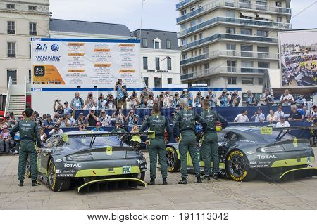 LE MANS FRANCE - JUNE 11 2017: Famous Danish racer Nicki Thiim with his race car Aston Martin and team Weighing administrative and technical checks of the race cars for competition 24 hours of Le mans circuit