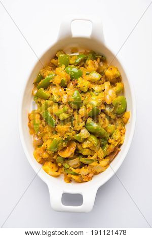 shimla mirch sabji or simla mirch sabzi or spicy capsicum indian food or vegetable recipe using lot of onion and chikpea flour