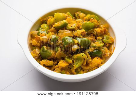 shimla mirch sabji or simla mirch sabzi or spicy capsicum indian food or vegetable recipe using lot of onion and chikpea flour