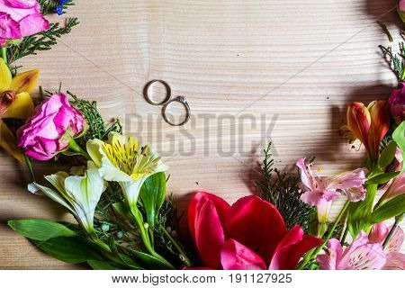 Stylish branding mockup to display your artworks. with flowers and rings Cute vintage mock up on wooden background.