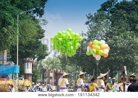 KOLKATA WEST BENGAL / INDIA - AUGUST 15TH 2016 : Colourful baloons are being carried in march past under blue sky to celebrate India's Independence day. The day is celebrate all over India with huge enthusiasm and joy.