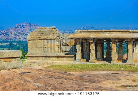 View from Hemakuta hill sunset point with ancient ruins Hampi, Karnataka, India. Landscape with unique mountain formation with amazing stones tropical nature and temple. UNESCO World Heritage Site