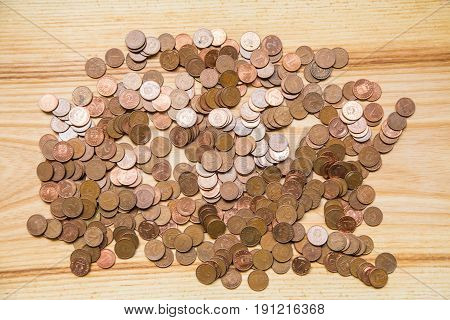 Old Latvian Coins On A Wooden Background