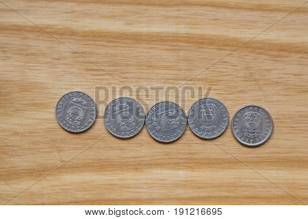 Old Latvian Coins On A Wooden Background