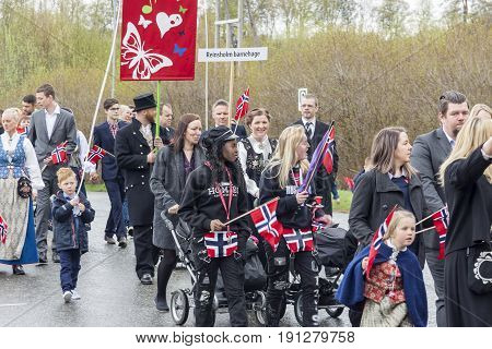 VERDAL NORWAY - MAY 17 2017: National day in Norway. Norwegians at traditional celebration and parade on may 17 2017 in Verdal. People on parde before school in Verdal. Constitution Day is the National Day of Norway.