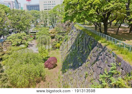 MARIOKA JAPAN - MAY 22 2017: Stone walls (ishigaki) of former Marioka castle constructed in 1633 and dismantled in 19th c. Today is National Historic Site of Japan and part of Iwate Park