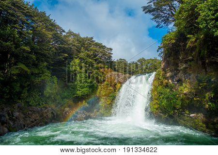 Water from volcano Mt Ruapehu forms Tawhai Falls in Tongariro National Park, New Zealand.