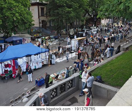 KIEV - UKRAINE - MAY, 2017: Vladimirskaya street on the Day of Kiev. People walk around the tents with Ukrainian souvenirs. Street lined with paving stones, chestnuts - a symbol of Kiev
