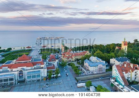 Sopot Poland - June 10 2017: Bird-eye view of Sheraton hotel against the wooden pier on the background in evening