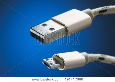 Cable micro-USB to USB connector. blue background