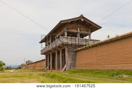 MORIOKA JAPAN - MAY 22 2017: Reconstructed Outer South Gate and clay wall (tsuijibei) of Shiwa Castle in Morioka Japan. Castle was erected in 803 against local emishi tribes and abandoned in 811