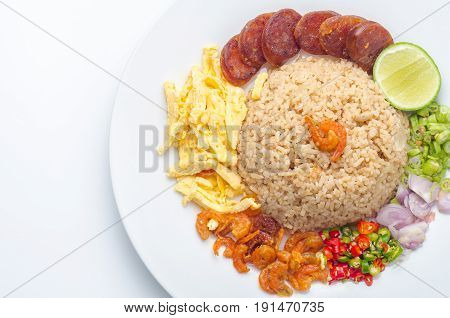 Rice Seasoned with Shrimp Paste Thai food Thai cuisine on white dish over white table.