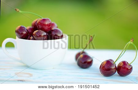 Red Ripe Cherry On A Background