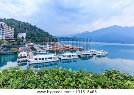 NANTOU, TAIWAN - APRIL 02, 2017: Long exposure of harbor with boats in the morning time at Sun Moon Lake Nantou city Taiwan
