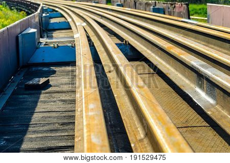 Railhead elements. Transportation of long new rails on a freight car. Endless path. The rail lash. Special load.