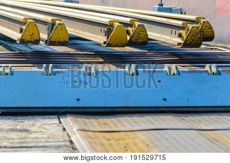 Railhead elements. Transportation of long new rails on a freight car. Endless path. The rail lash. Special load.