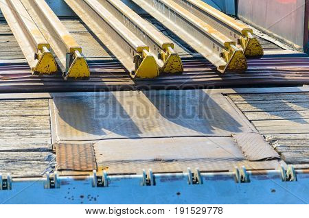 Railhead elements. Transportation of long new rails on a freight car. Endless path. The rail lash. Special load.