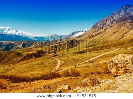 beautiful landscape of deserted Caucasus mountains with road Russia Republic Ingushetia