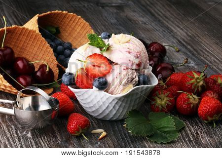 Strawberry Ice Cream In White Bowl With Fresh Strawberries And Blueberries