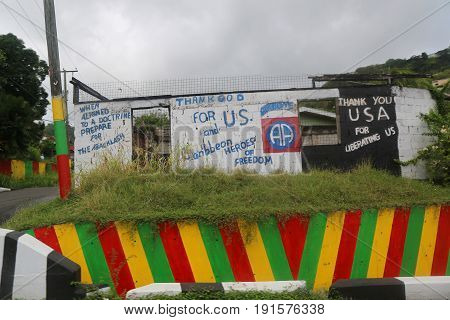 ST. GEORGE'S, GRENADA - JUNE 13, 2017: Street sign praise US and Caribbean Heroes for liberating Grenada in St. George's, Grenada
