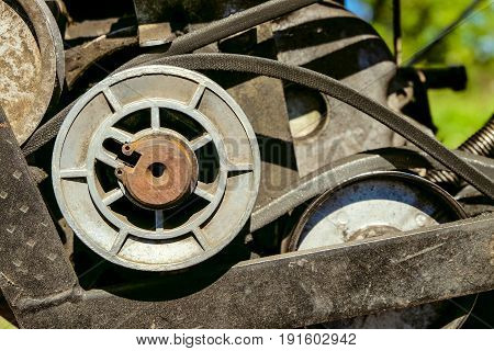Pulley with belt drive of agricultural motorized machine. Agrimotor detail.