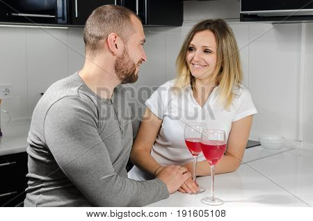 couple in love drinking wine at home