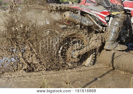 Racing enduro  dirt wheel in muddy track