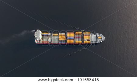 Aerial view of huge container ship floating in the sea