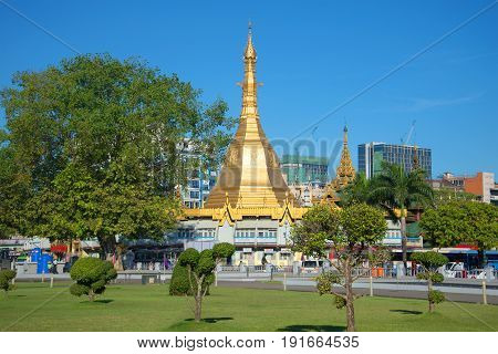 YANGON, MYANMAR - DECEMBER 18, 2016: Sule Pagoda against the backdrop of modern Yangon
