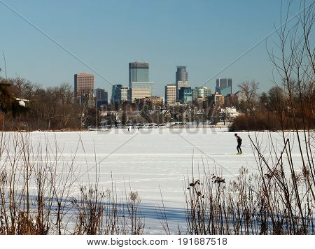 Skiing Under The Minneapolis Skyline On Lake Of The Isles