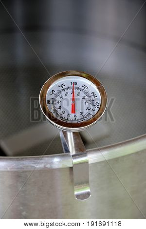 Dial Thermometer in Heating Water for Beer