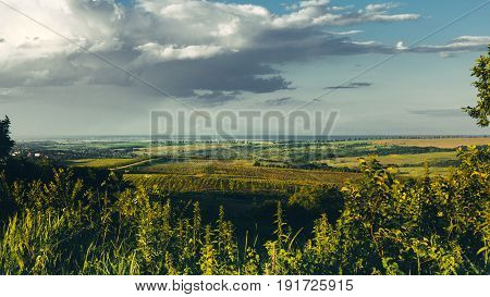 Scenic Agricultural Landscape With Green Hills And Meadow On Blue Sky Background