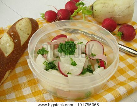 Picnic with radish salad and lye roll
