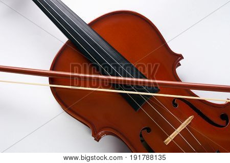 Violin with bow isolated on white background. Classical stringed musical instrument fiddle with fiddlestick.