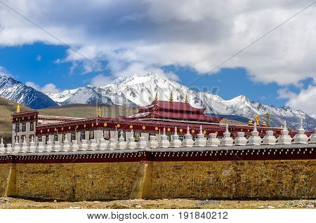 View on Gyergo monastery and Mount Yala by tagong grassland in Sichuan province