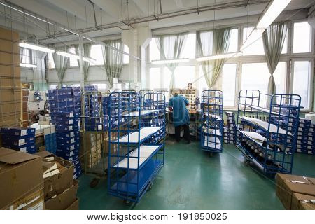 MOSCOW - FEB 21, 2017: Conveyor with modern shoes in workshop in Ralf Ringer factory. Company production is 1,5 million pairs per year